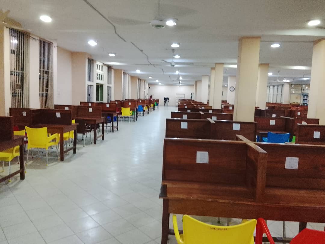 Long rows of wooden study desks in the main library