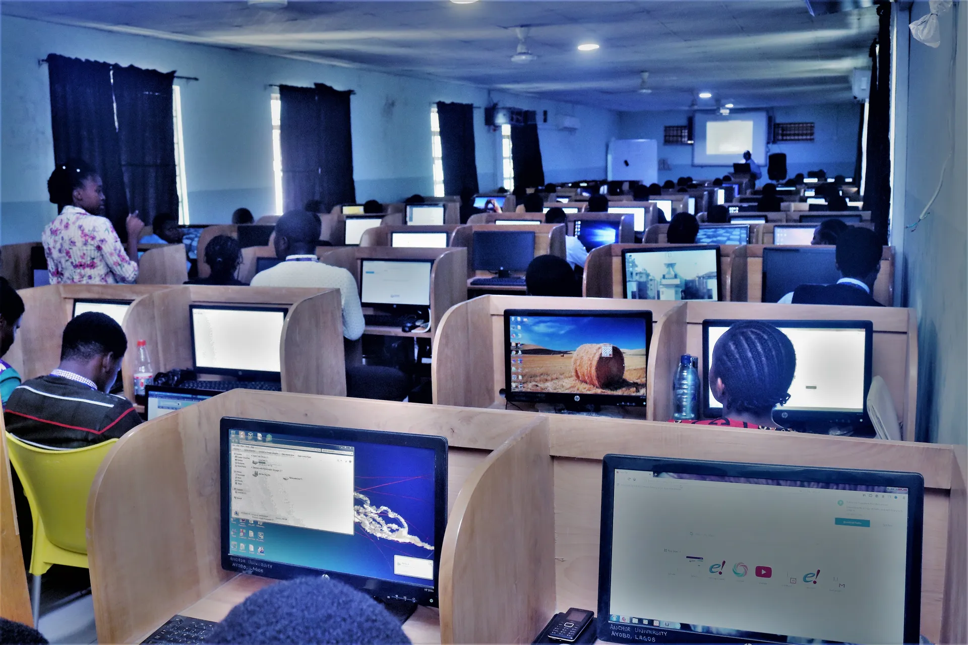 Rows of desktop computers in a teaching room