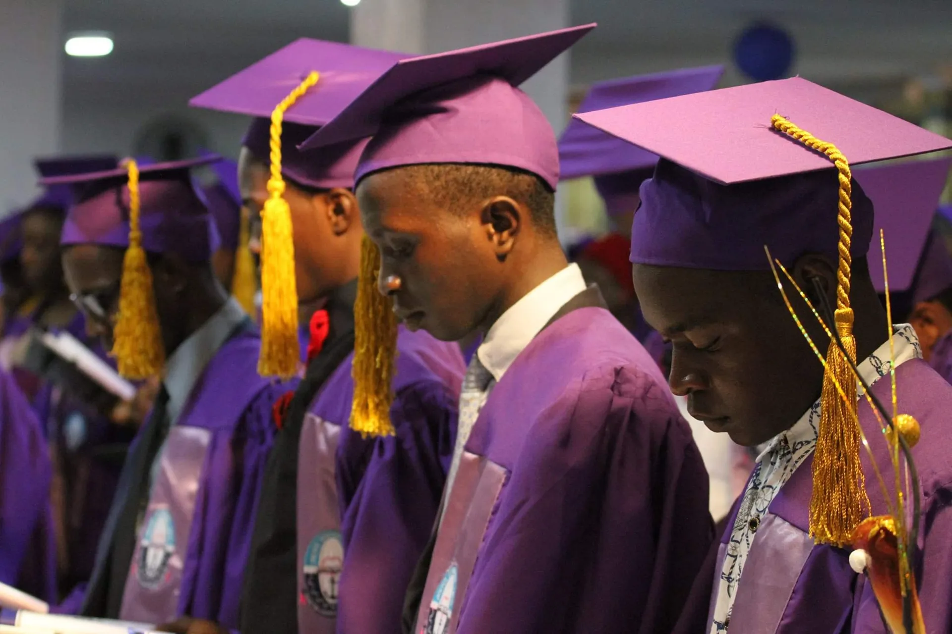 Students wearing academic regalia at matriculation