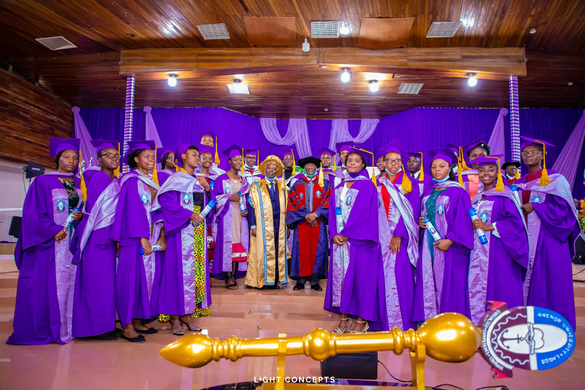 University officials and graduates in academic regalia