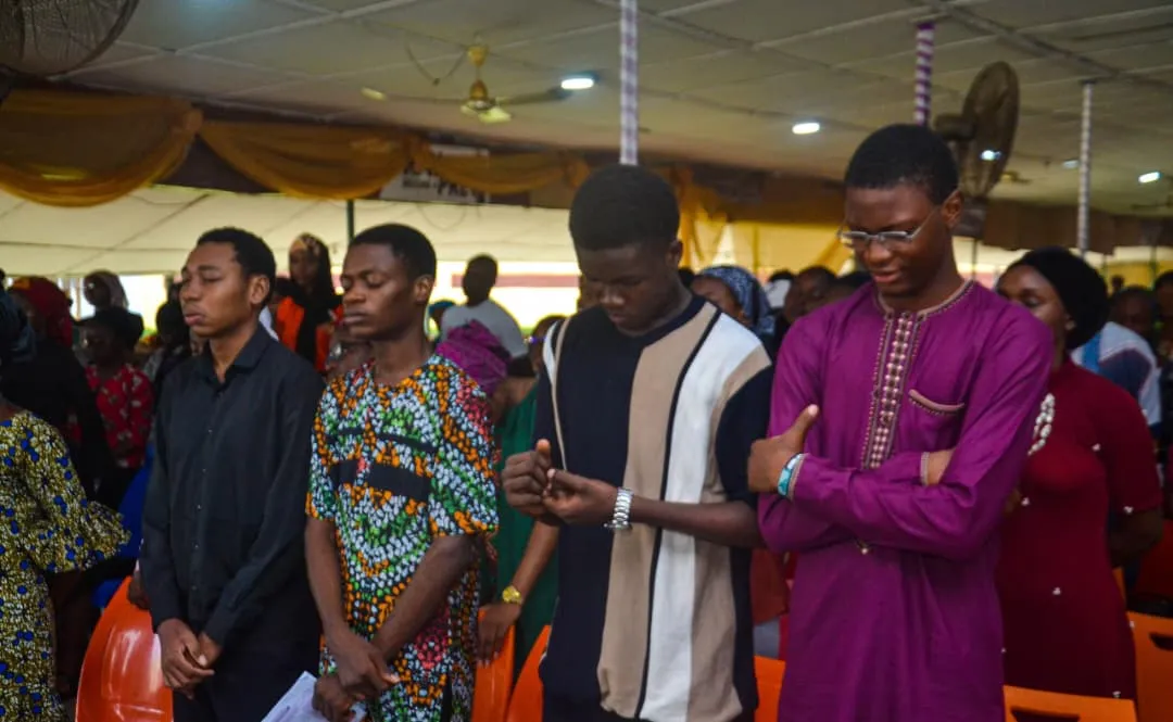 Students standing during chapel worship