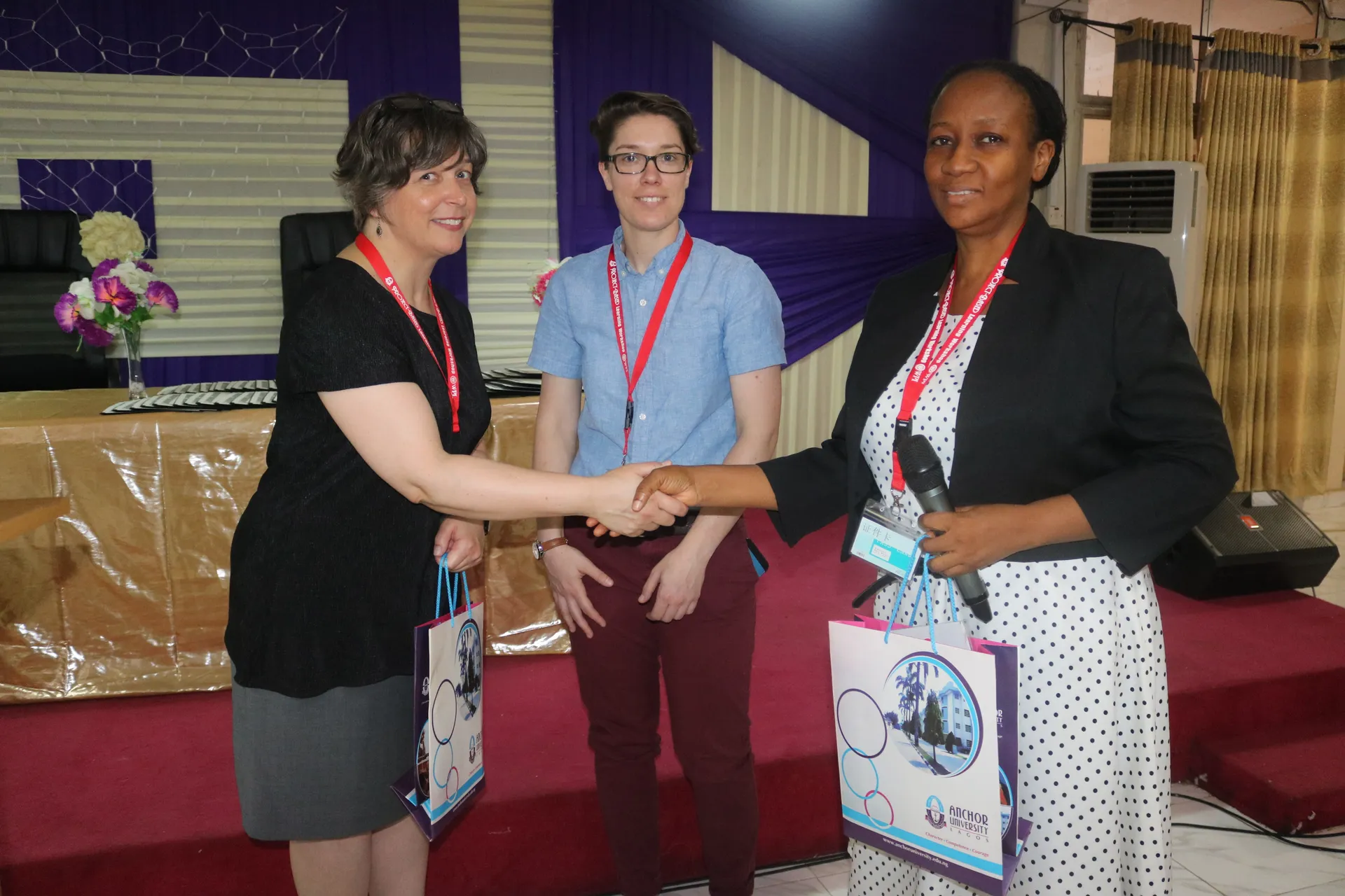 Participants exchanging an item during a collaboration event