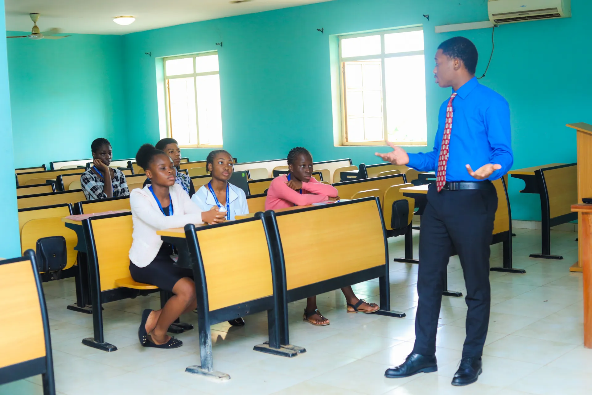 Students learning with a lecturer in a classroom