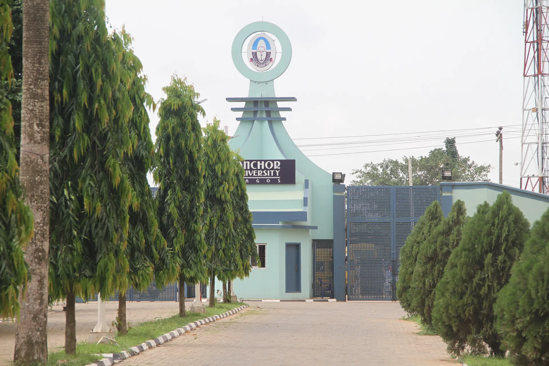 Anchor University entrance and tree-lined approach